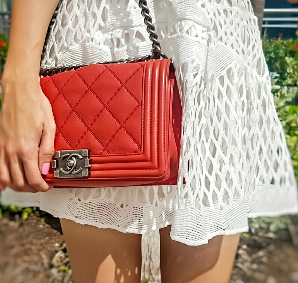 Red chanel medium bag details and white crochet dress