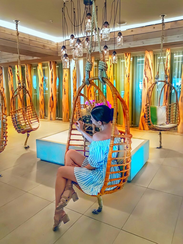 Amara Cay Resort beautiful lobby decor swings