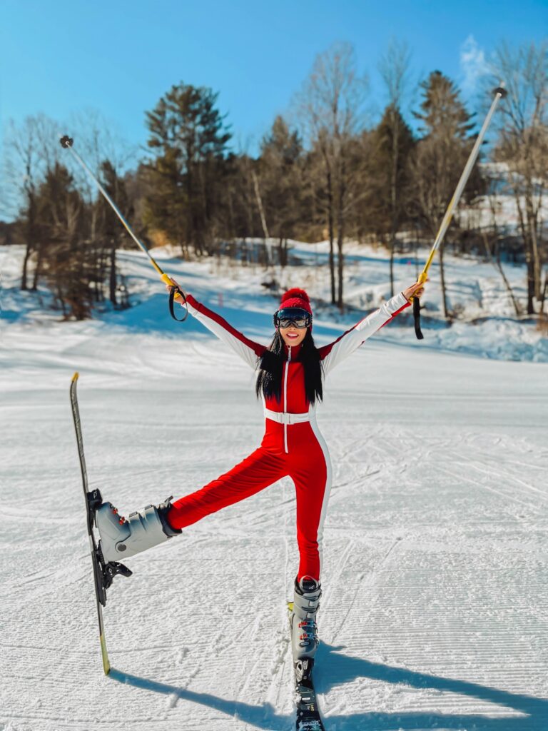 Ski suit inspo 2024, what to wear to ski vacation. Red cordova ski suit